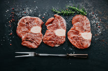 Load image into Gallery viewer, Osso Bucco All Natural grain finished Black angus. This cut of beef makes the most unbelievably good stews. Let it simmer with your favourate spices and vegetable and be amazed by the result.

